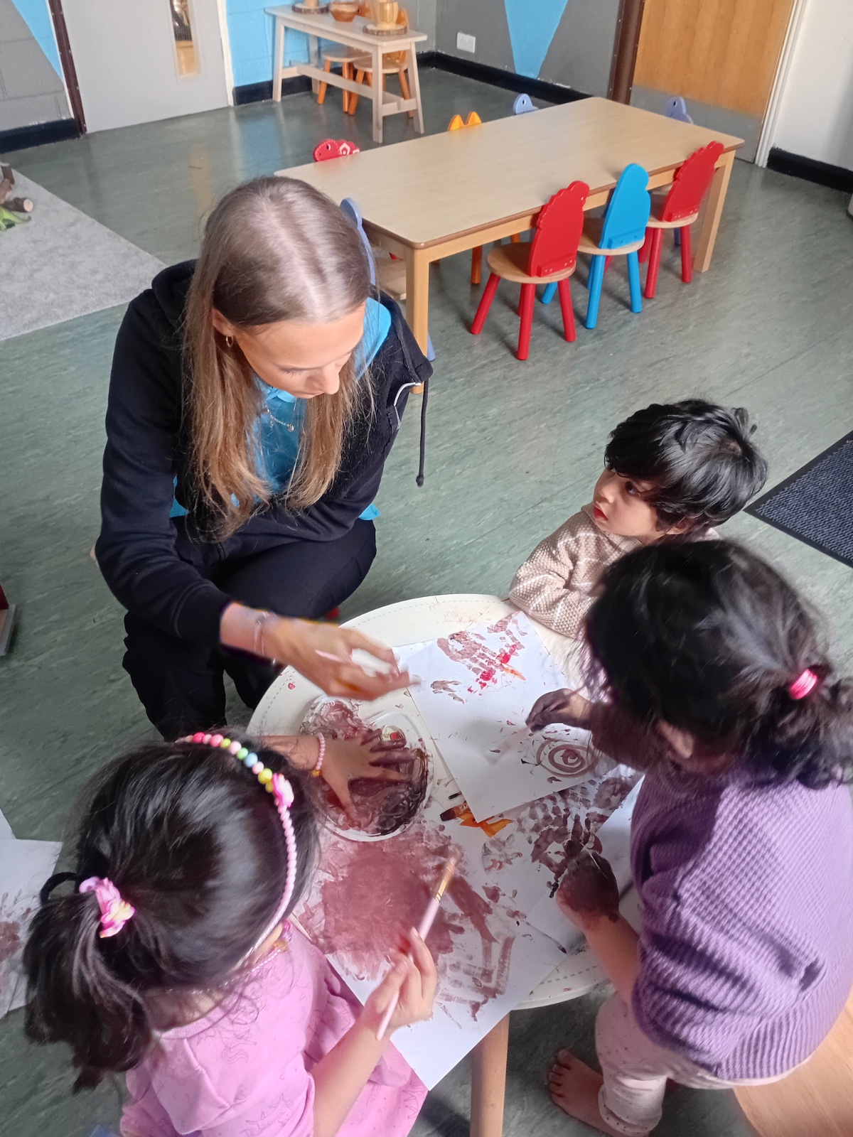 Teacher holding child